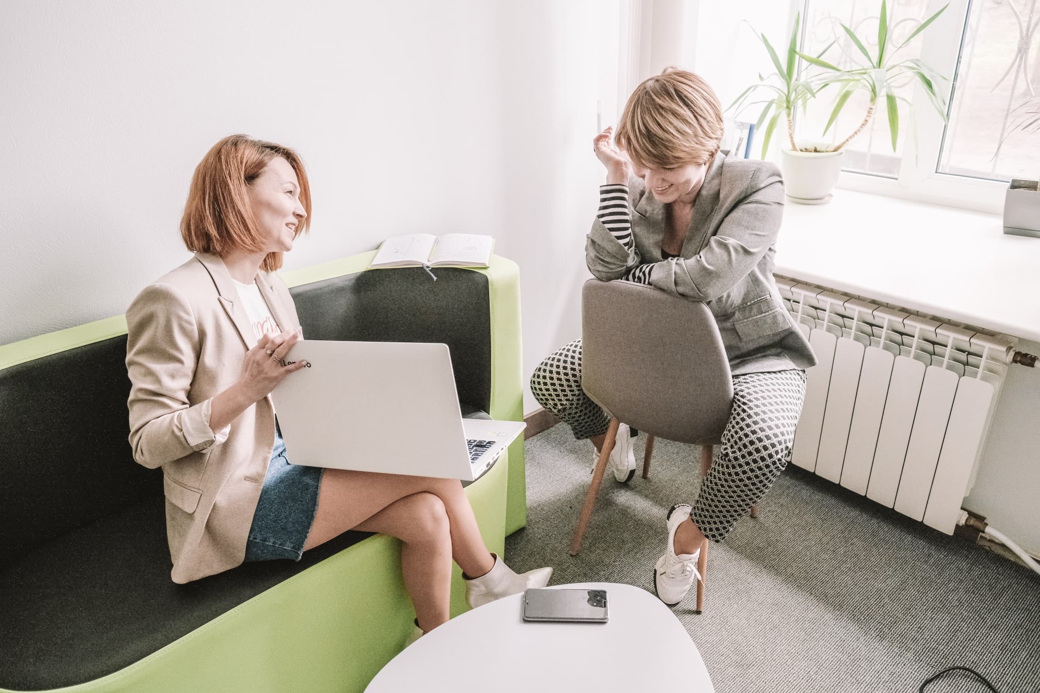 two-business-women-working-with-laptop-at-the-modern-office_t20_gRevv7